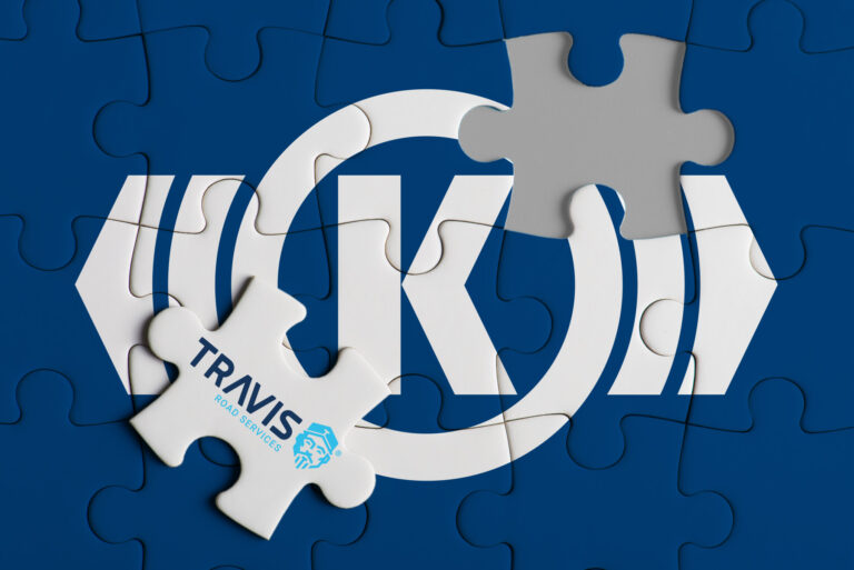 Puzzle pieces forming the Knorr-Bremse logo, with a TRAVIS Road Services piece completing the image, symbolizing the acquisition partnership.